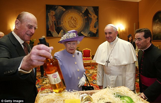 Queen Elizabeth gives Pope Francis a bottle of Balmoral Single Malt Scotch on her visit to the Vatican in April, 2014.
