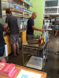 Patrick Santillo, Wigle's front of house manager, prepping some taste samples in the tasting room.